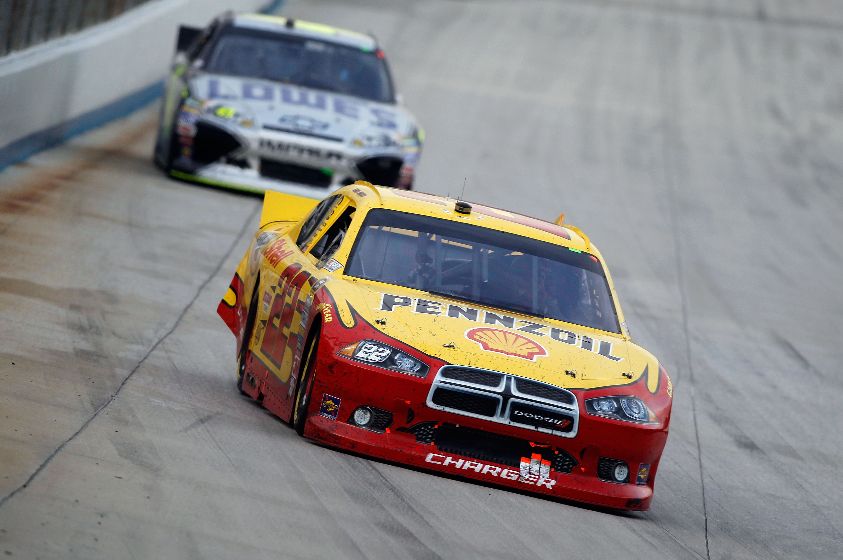 Credit: Todd Warshaw/Getty Images for NASCAR Kurt Busch leads Jimmie Johnson late in the NASCAR Sprint Cup Series AAA 400 on Sunday at Dover International Speedway in Dover, Del.